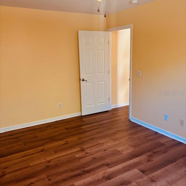 925 East Rembrandt Way, Unit 104 Inverness, FL 34453 - Photo 33 of 36 a view of an empty room with wooden floor