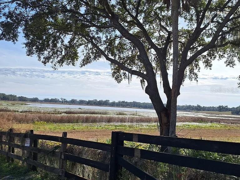 925 East Rembrandt Way, Unit 104 Inverness, FL 34453 - Photo 36 of 36 a view of lake with outdoor seating