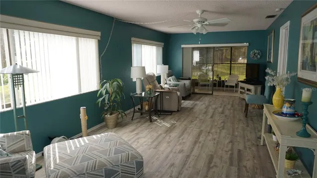 a living room with furniture window and wooden floor