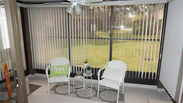 a view of a room with furniture and a window
