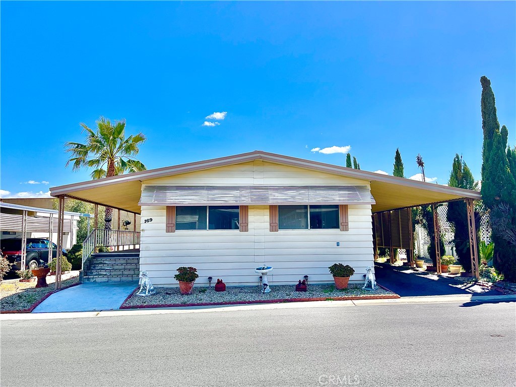 4000 Pierce Street, Unit 169 Riverside, CA 92505 - Photo 1 of 1 a front view of a house with a yard