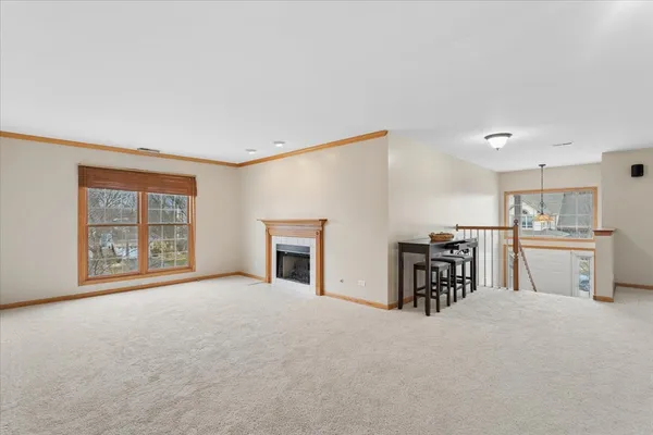 a view of a livingroom with furniture and a kitchen
