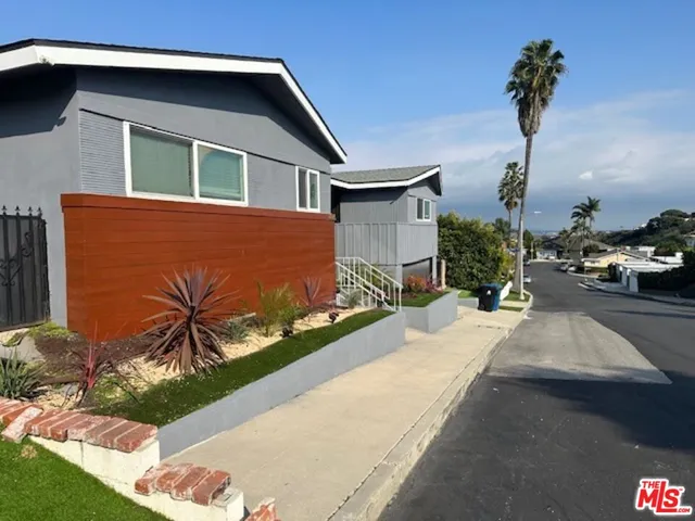 a house view with a garden space