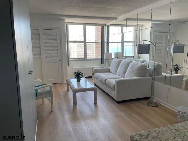 a living room with furniture and a large window