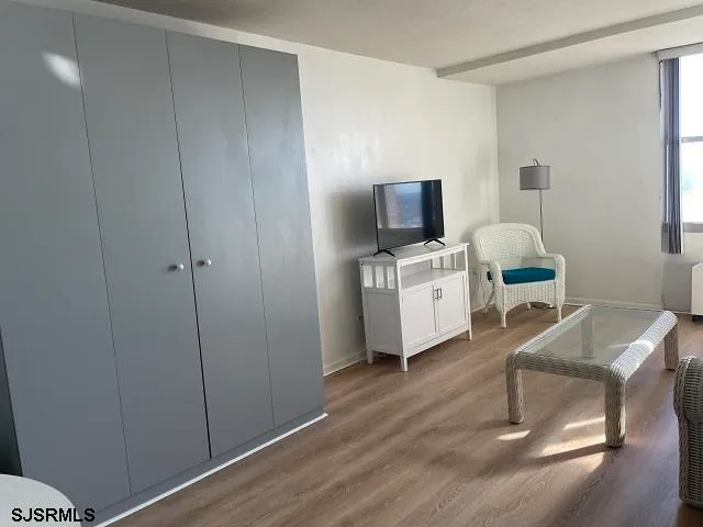 a room with furniture and a flat screen tv