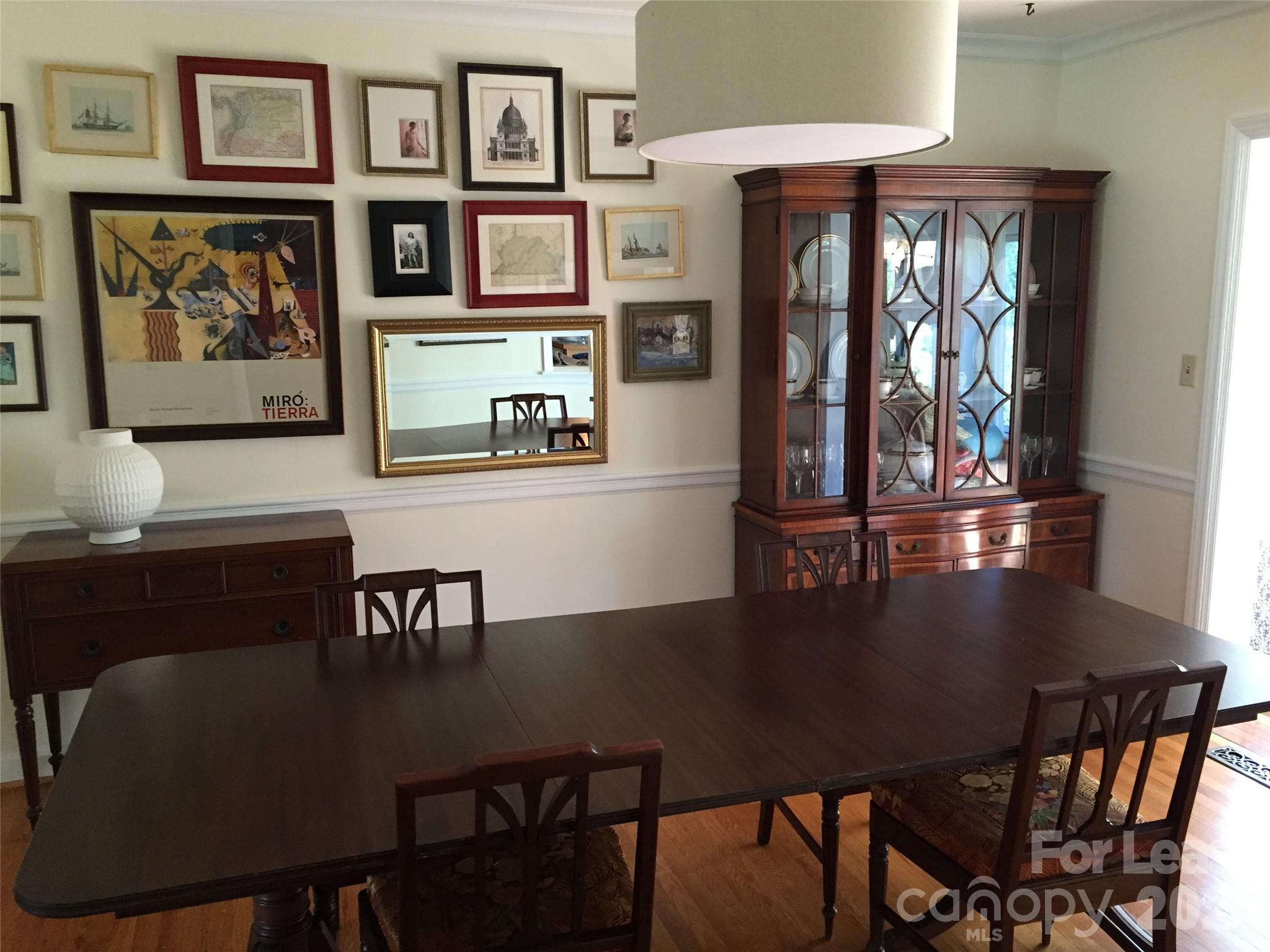 3922 Fellsway Road Charlotte, NC 28209 - Photo 16 of 31 a view of a dining room with furniture window and wooden floor