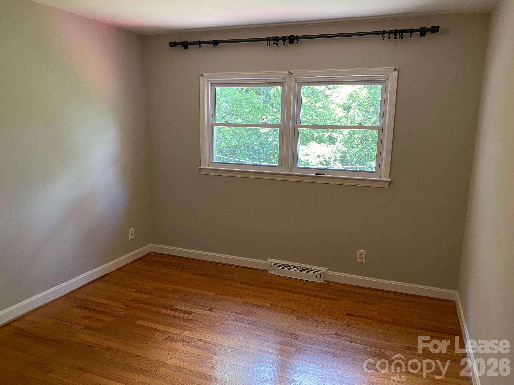 3922 Fellsway Road Charlotte, NC 28209 - Photo 30 of 31 a view of a room with wooden floor and window