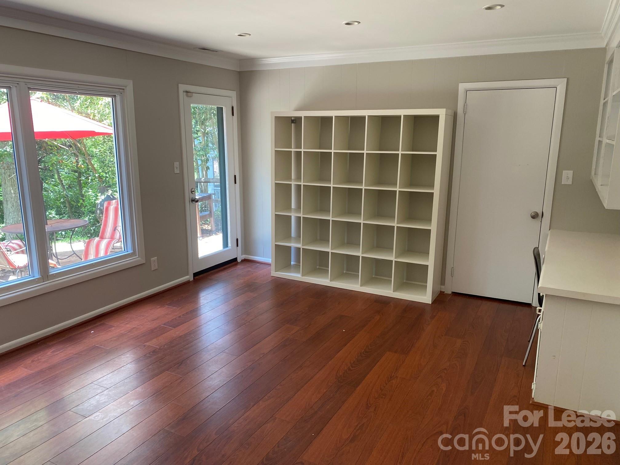 3922 Fellsway Road Charlotte, NC 28209 - Photo 10 of 31 an empty room with wooden floor and windows