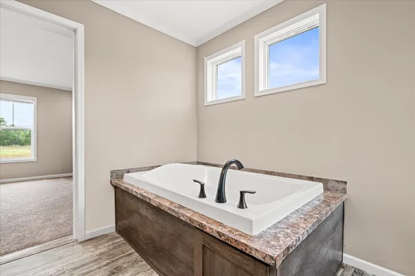 a white bath tub sitting in a bathroom