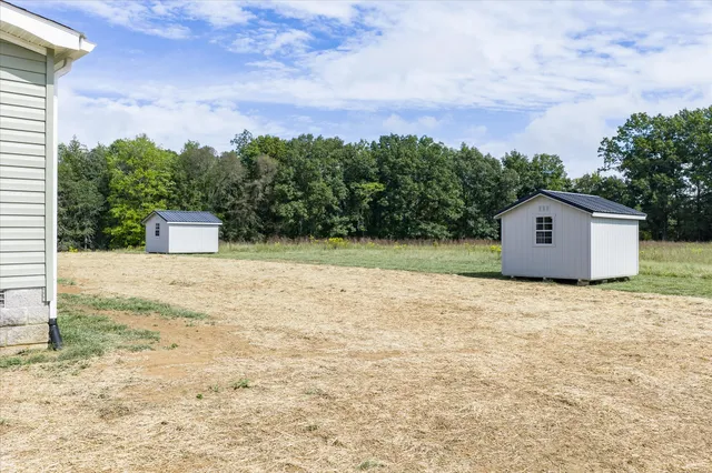 a house view with a backyard space