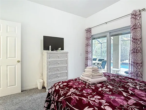 a bedroom with two beds and a window