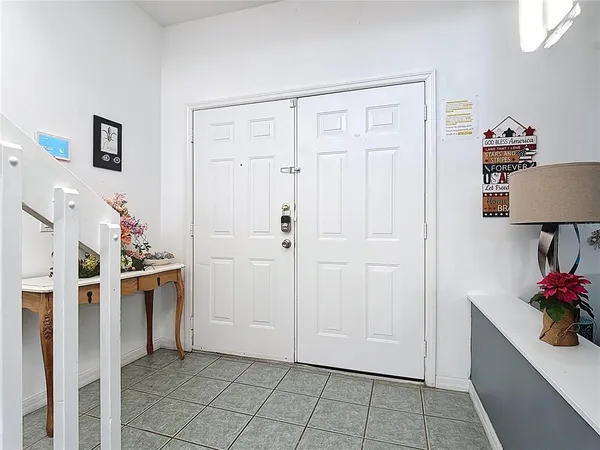 a kitchen with stainless steel appliances granite countertop a sink and a refrigerator