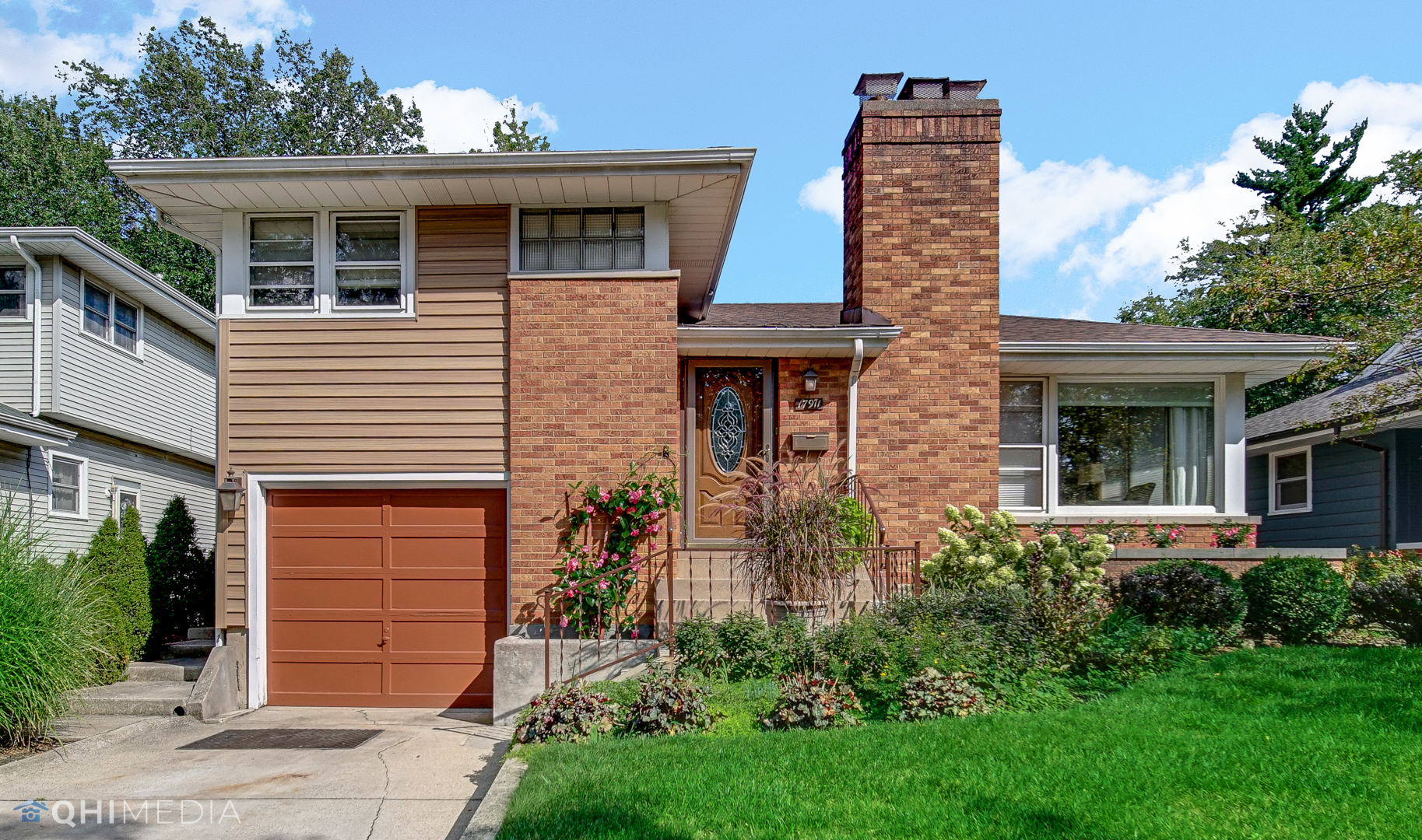 17911 Riedle Court Homewood, IL 60430 - Photo 1 of 23 a front view of a house with a yard