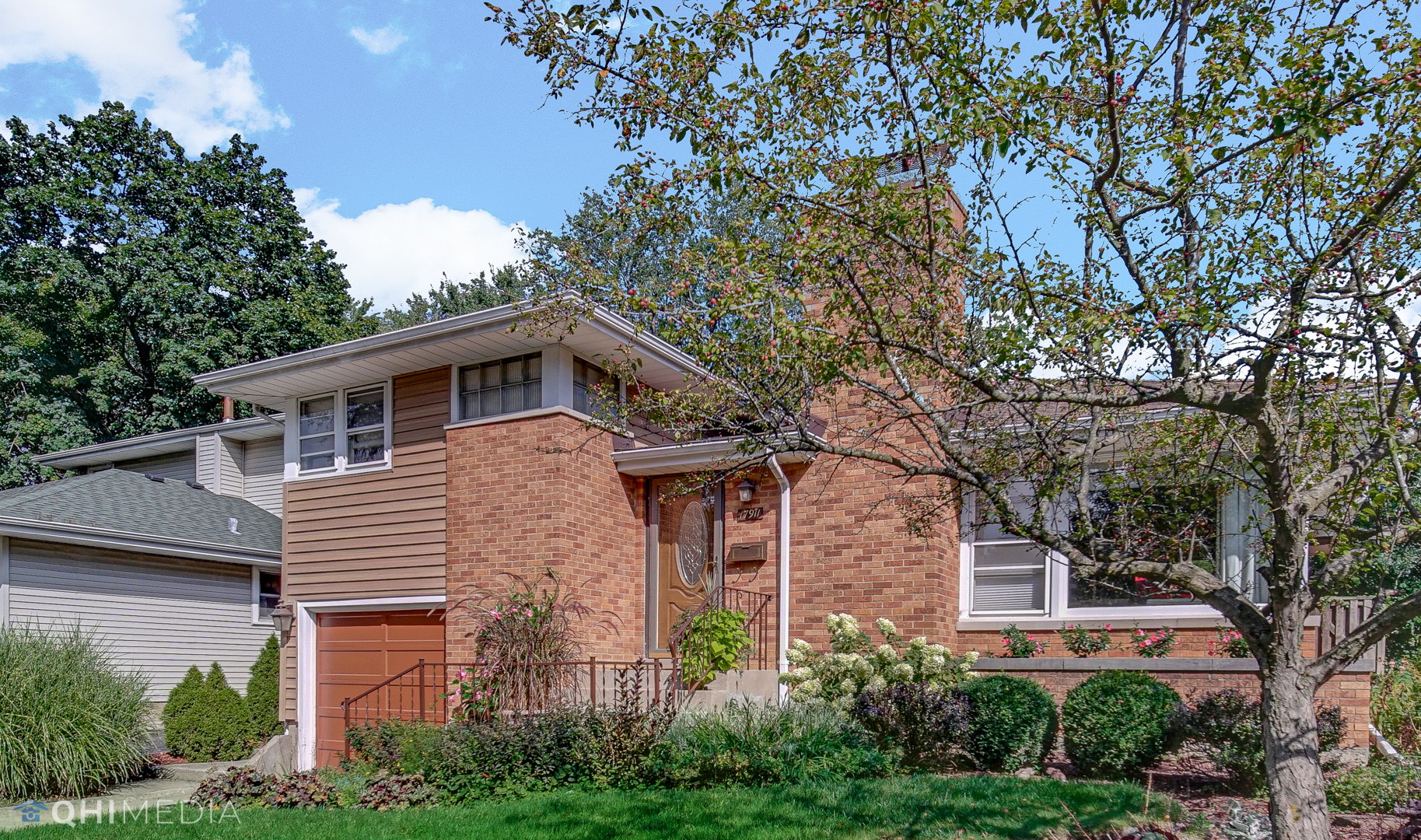 17911 Riedle Court Homewood, IL 60430 - Photo 2 of 23 a front view of a house with plants and trees