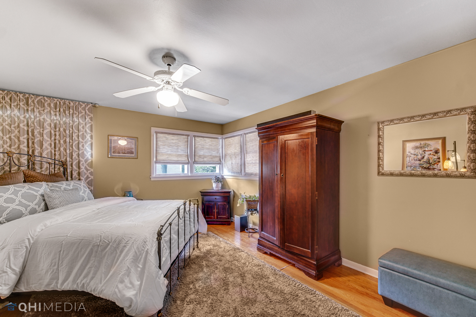 17911 Riedle Court Homewood, IL 60430 - Photo 11 of 23 a bedroom with a bed and a chandelier