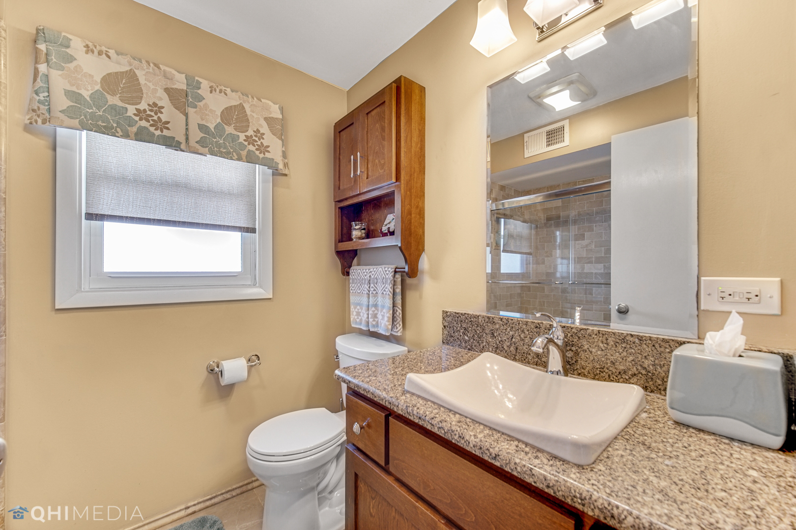 17911 Riedle Court Homewood, IL 60430 - Photo 14 of 23 a bathroom with a granite countertop sink and a mirror with toilet