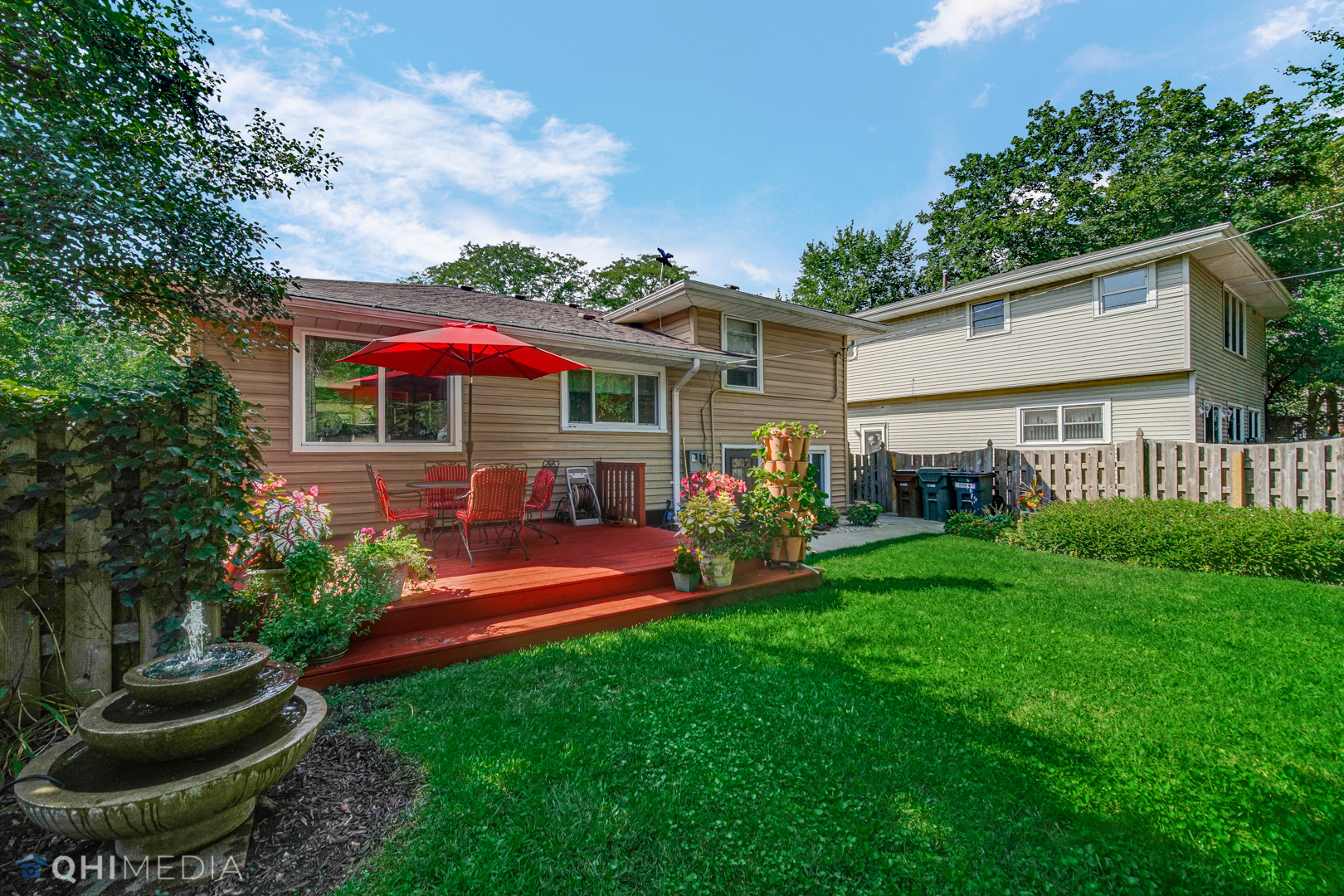 17911 Riedle Court Homewood, IL 60430 - Photo 23 of 23 a view of a house with backyard sitting area and garden