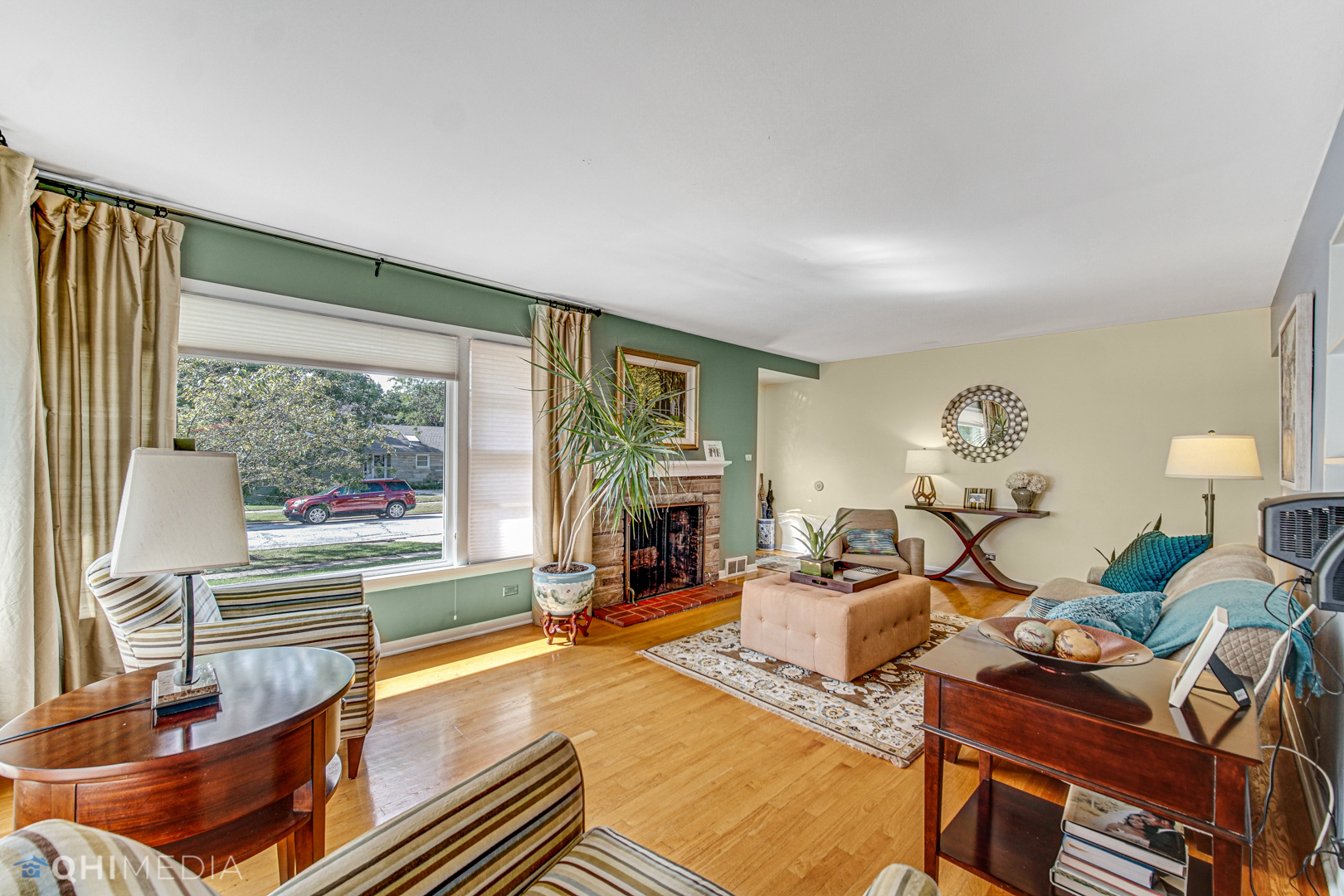 17911 Riedle Court Homewood, IL 60430 - Photo 5 of 23 a living room with fireplace furniture and a large window