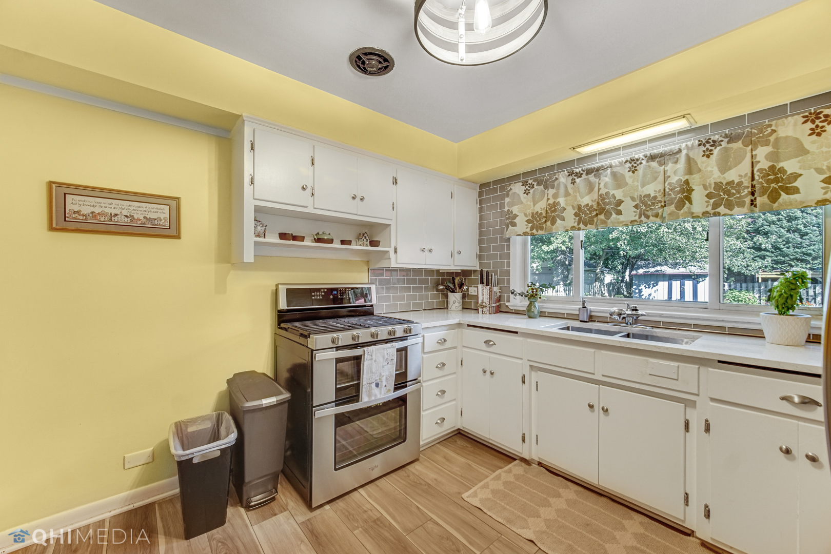 17911 Riedle Court Homewood, IL 60430 - Photo 7 of 23 a kitchen with a sink stove and cabinets