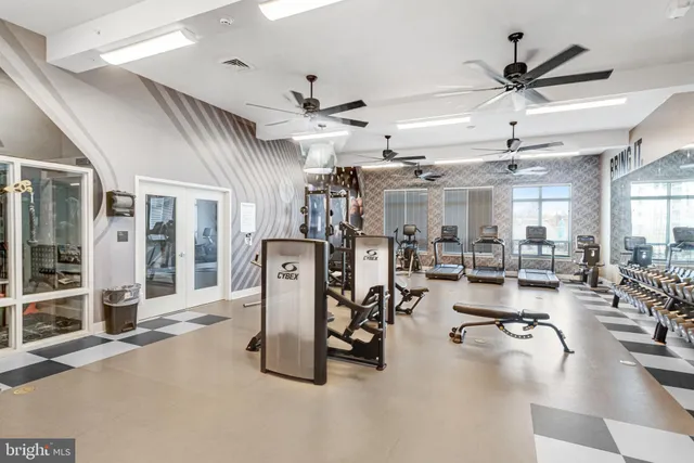 a view of a kitchen with a large window and sitting area