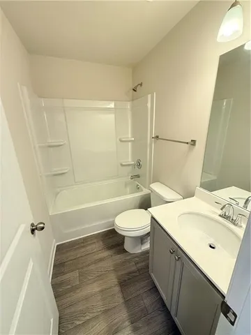 a bathroom with a sink a toilet and a bathtub