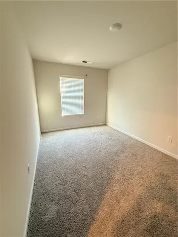 an empty room with a natural light