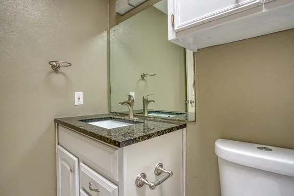 a bathroom with a toilet and a bathtub