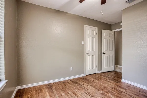 a view of a livingroom with wooden floor
