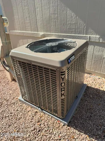 a view of a sink with wooden wall