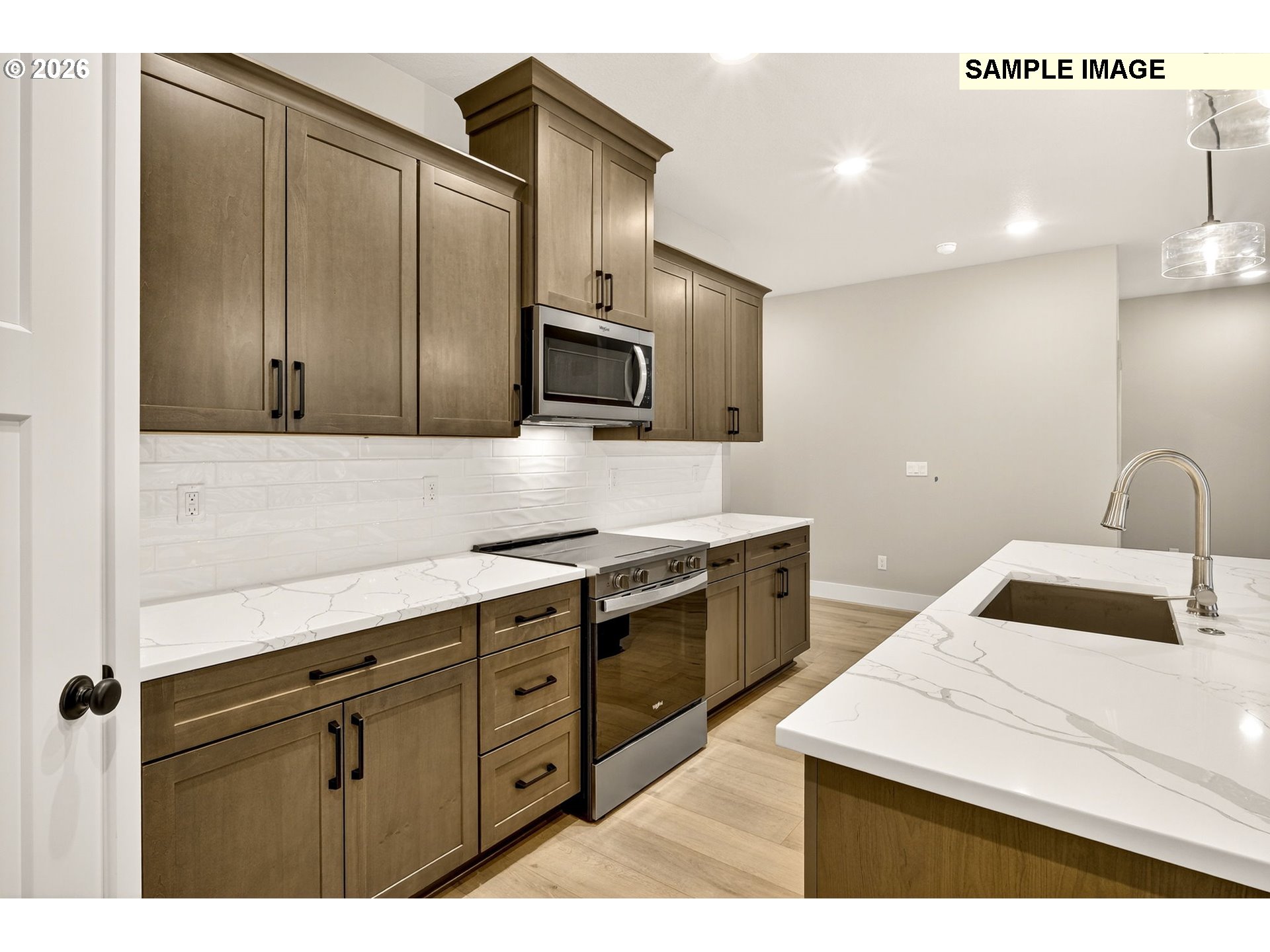 3352 Northeast Sweetwater Road, Unit 80 Estacada, OR 97023 - Photo 16 of 48 a kitchen with a sink a stove and cabinets