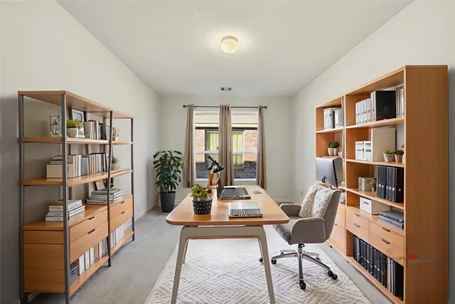 a living room with furniture cabinets and a book shelf