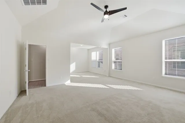 a view of an empty room with a window