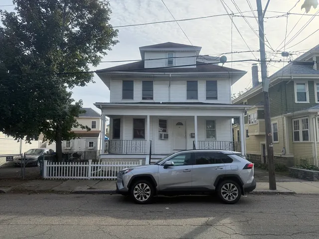 a car parked in front of a house