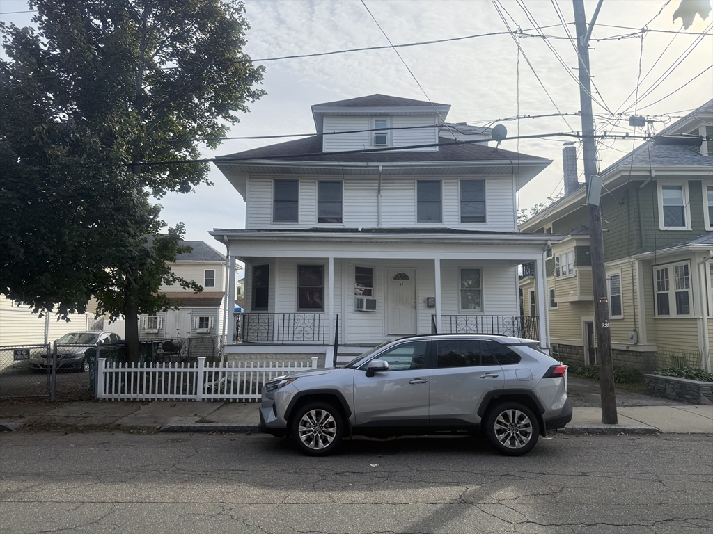 a car parked in front of a house