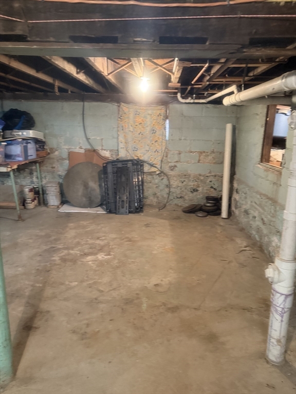 82 2nd Street Medford, MA 02155 - Photo 20 of 38 a view of a room with wooden shelves