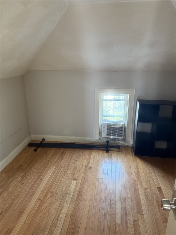 82 2nd Street Medford, MA 02155 - Photo 21 of 38 a view of a room with wooden floor and window