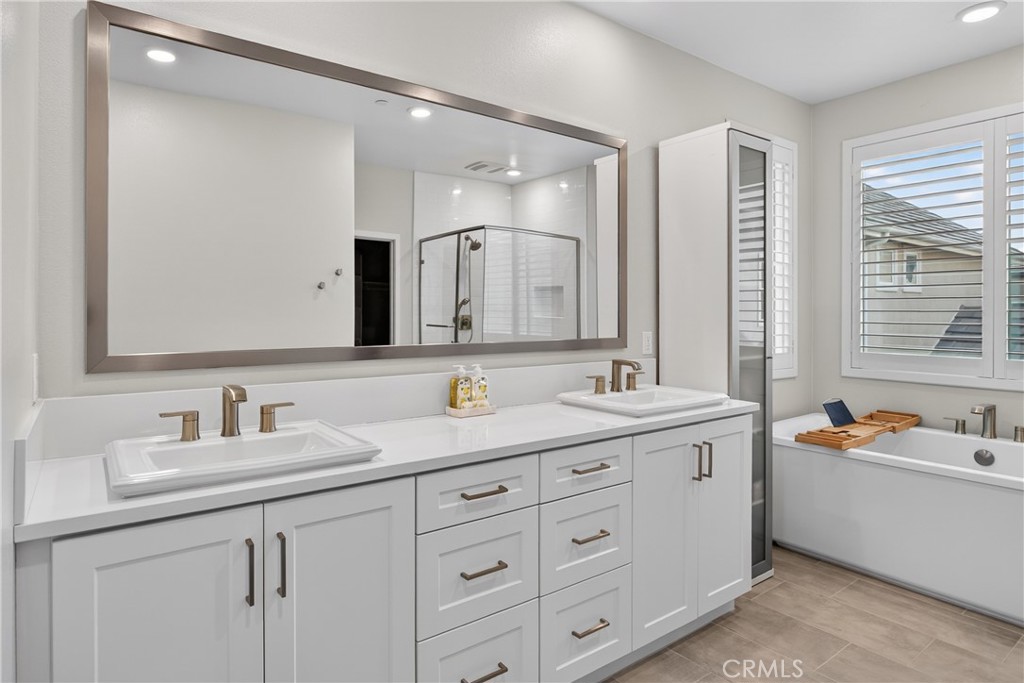 382 Chorus Irvine, CA 92618 - Photo 16 of 38 a bathroom with a double vanity sink mirror and double