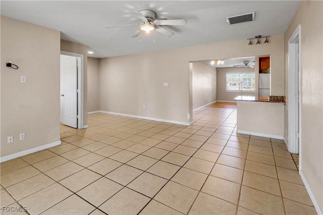 2301 Hibiscus Road Fort Myers, FL 33905 - Photo 15 of 40 a view of a livingroom with an empty space and a ceiling fan