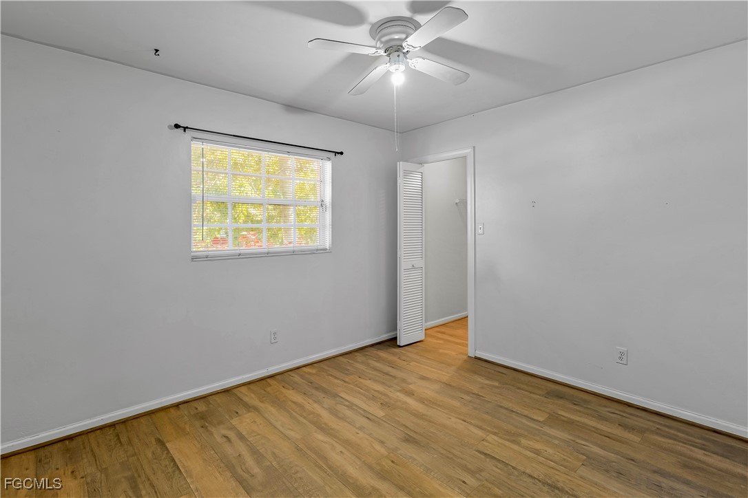 2301 Hibiscus Road Fort Myers, FL 33905 - Photo 20 of 40 an empty room with a window and a ceiling fan