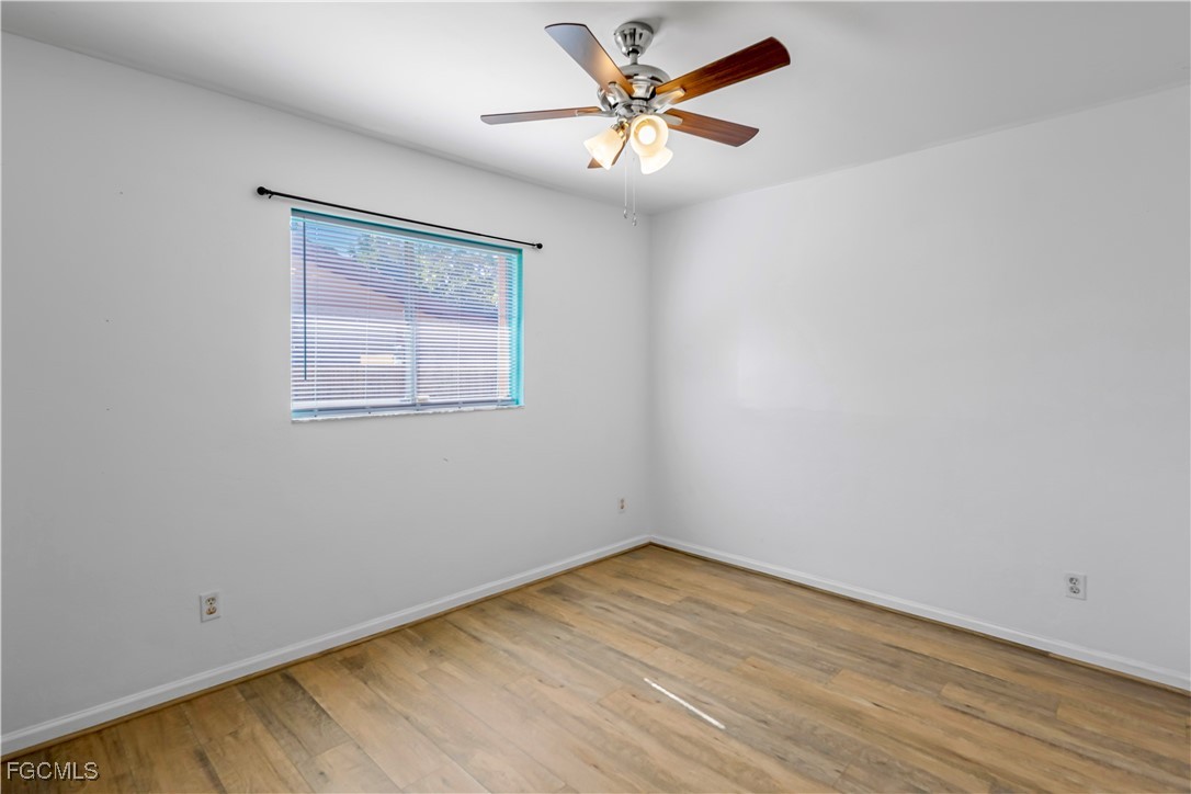 2301 Hibiscus Road Fort Myers, FL 33905 - Photo 21 of 40 an empty room with a window and a fan