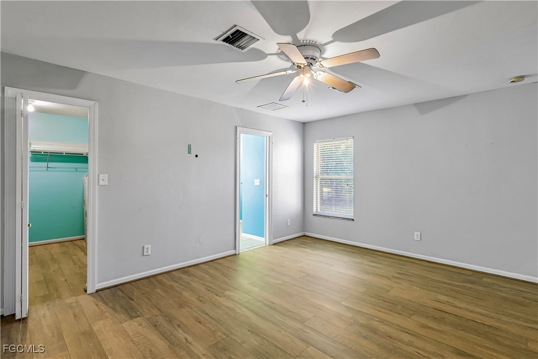 2301 Hibiscus Road Fort Myers, FL 33905 - Photo 26 of 40 a view of an empty room with wooden floor