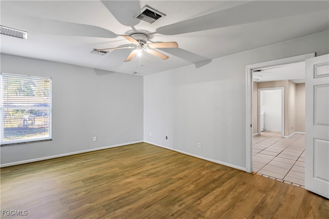 2301 Hibiscus Road Fort Myers, FL 33905 - Photo 27 of 40 an empty room with fan and windows