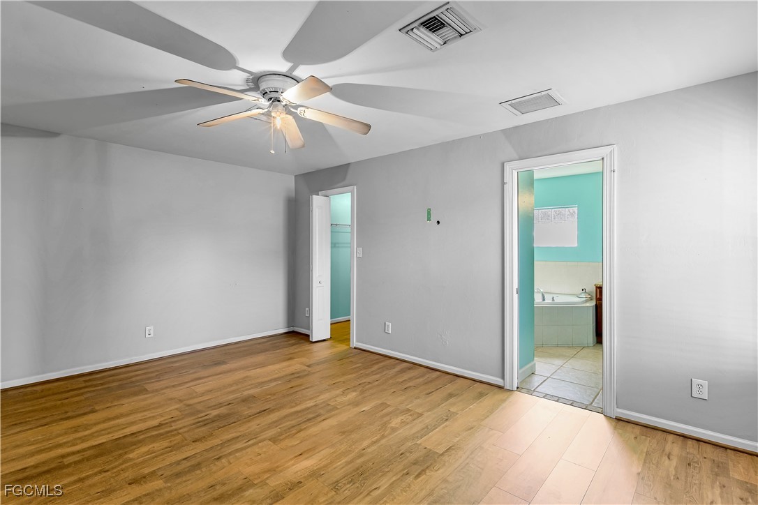 2301 Hibiscus Road Fort Myers, FL 33905 - Photo 28 of 40 an empty room with fan and entrance