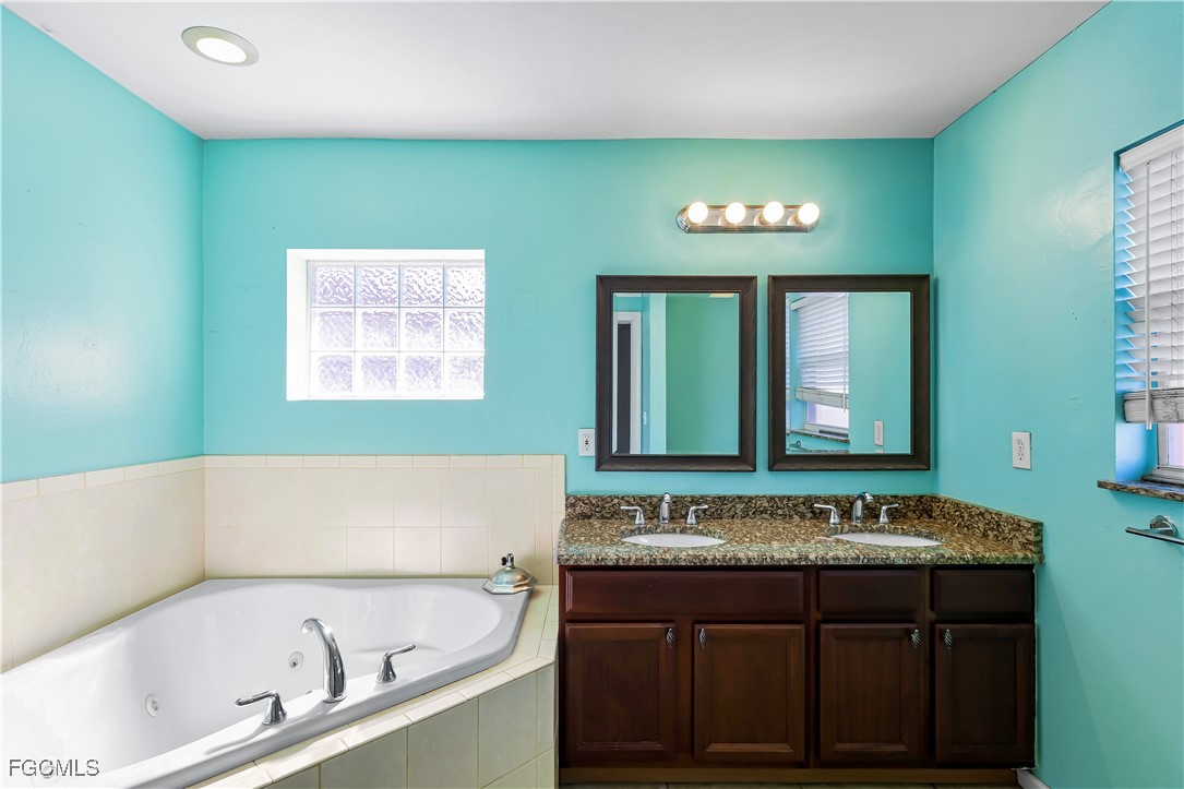 2301 Hibiscus Road Fort Myers, FL 33905 - Photo 30 of 40 a bathroom with a bathtub and a sink