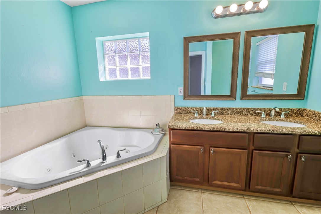 2301 Hibiscus Road Fort Myers, FL 33905 - Photo 31 of 40 a bathroom with a bathtub and a sink