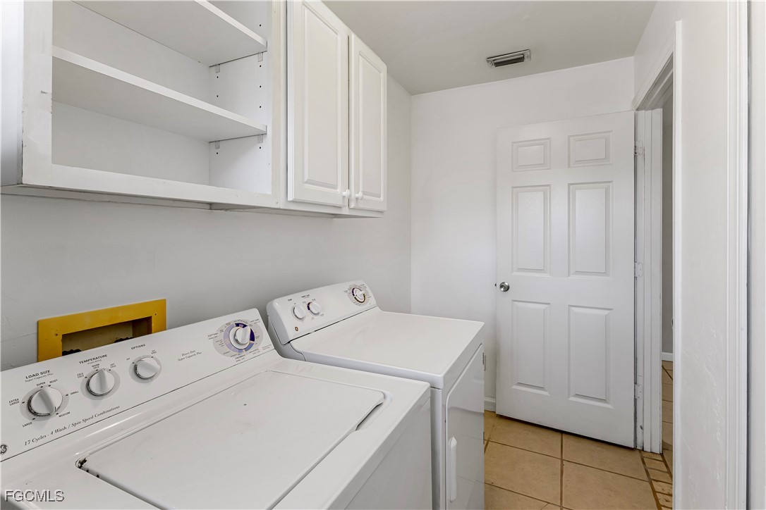 2301 Hibiscus Road Fort Myers, FL 33905 - Photo 9 of 40 a utility room with dryer and washer