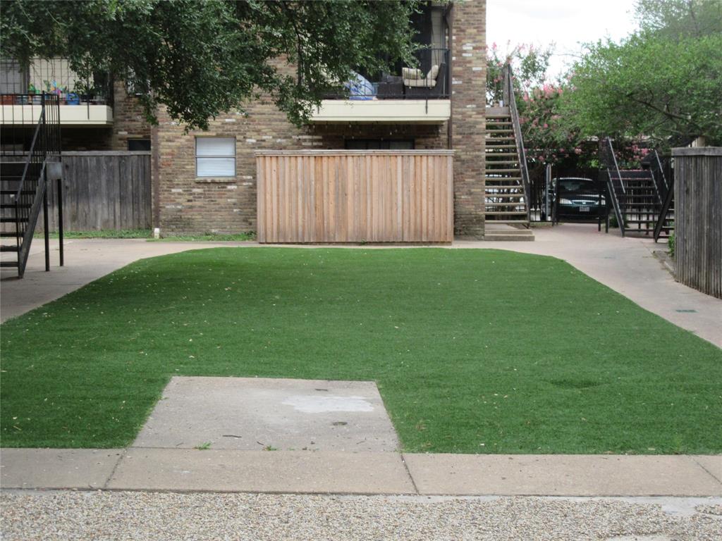 1810 North Garrett Avenue, Unit 106 Dallas, TX 75206 - Photo 2 of 9 a view of outdoor space with deck and tree