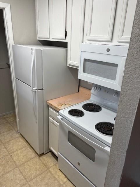 1810 North Garrett Avenue, Unit 106 Dallas, TX 75206 - Photo 5 of 9 a white refrigerator freezer sitting inside of a kitchen