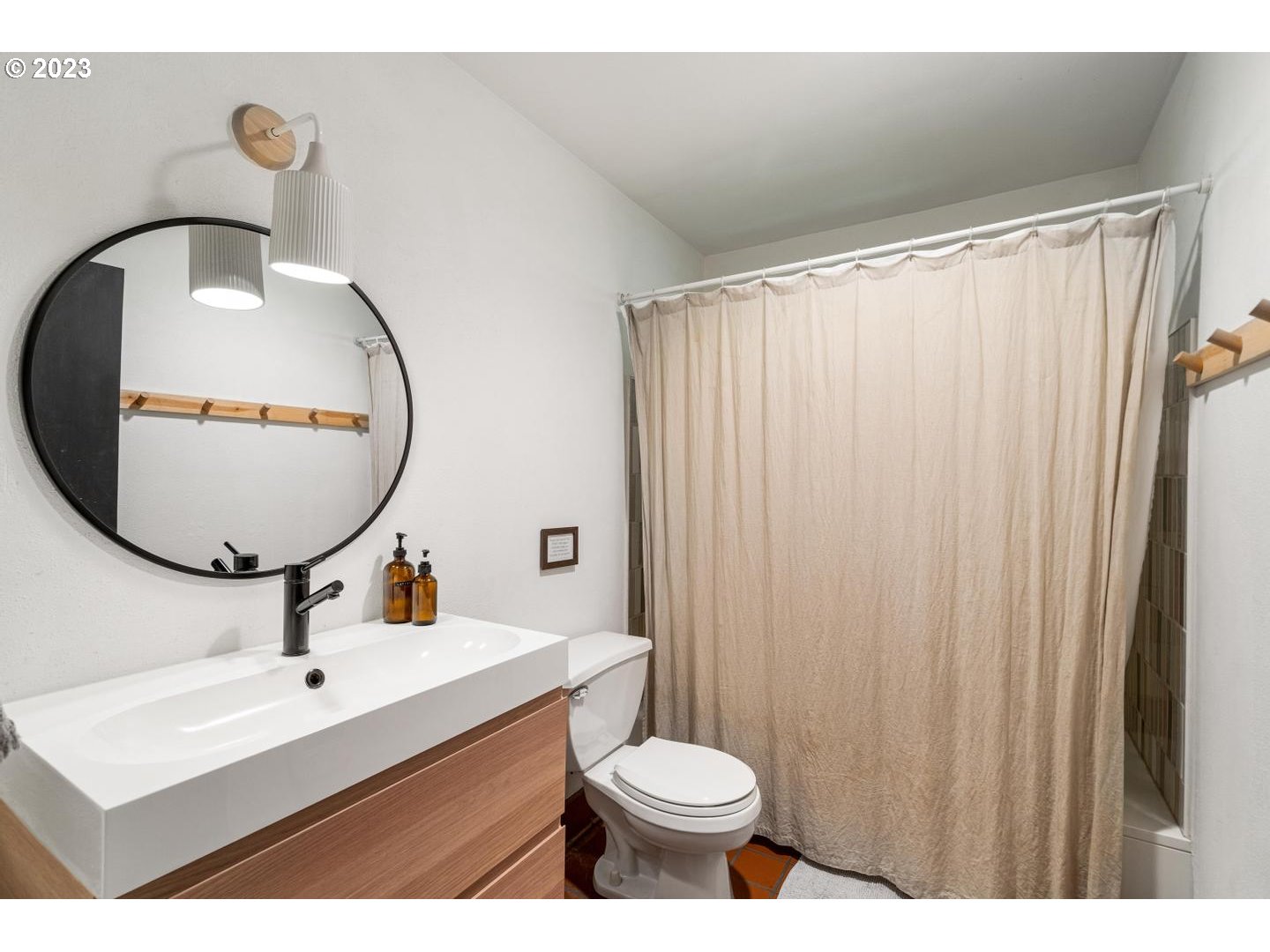 72715 East Village Loop Road Rhododendron, OR 97049 - Photo 19 of 48 a bathroom with a sink mirror vanity and toilet