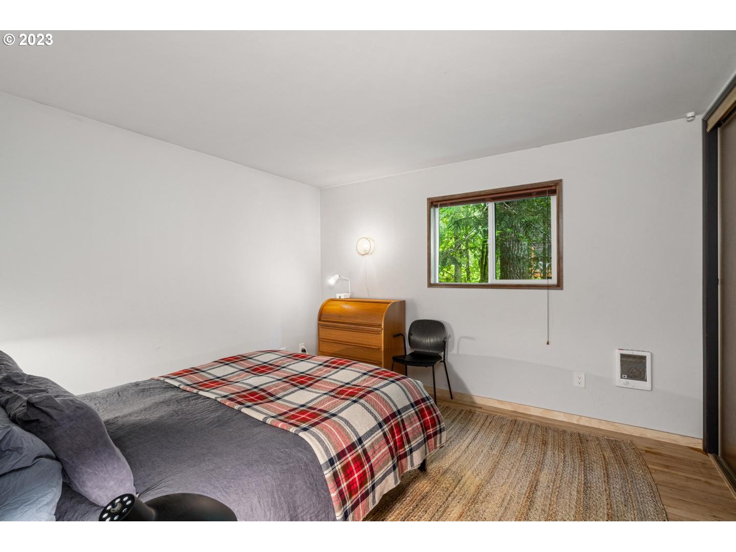 72715 East Village Loop Road Rhododendron, OR 97049 - Photo 20 of 48 a bedroom with a bed and a window